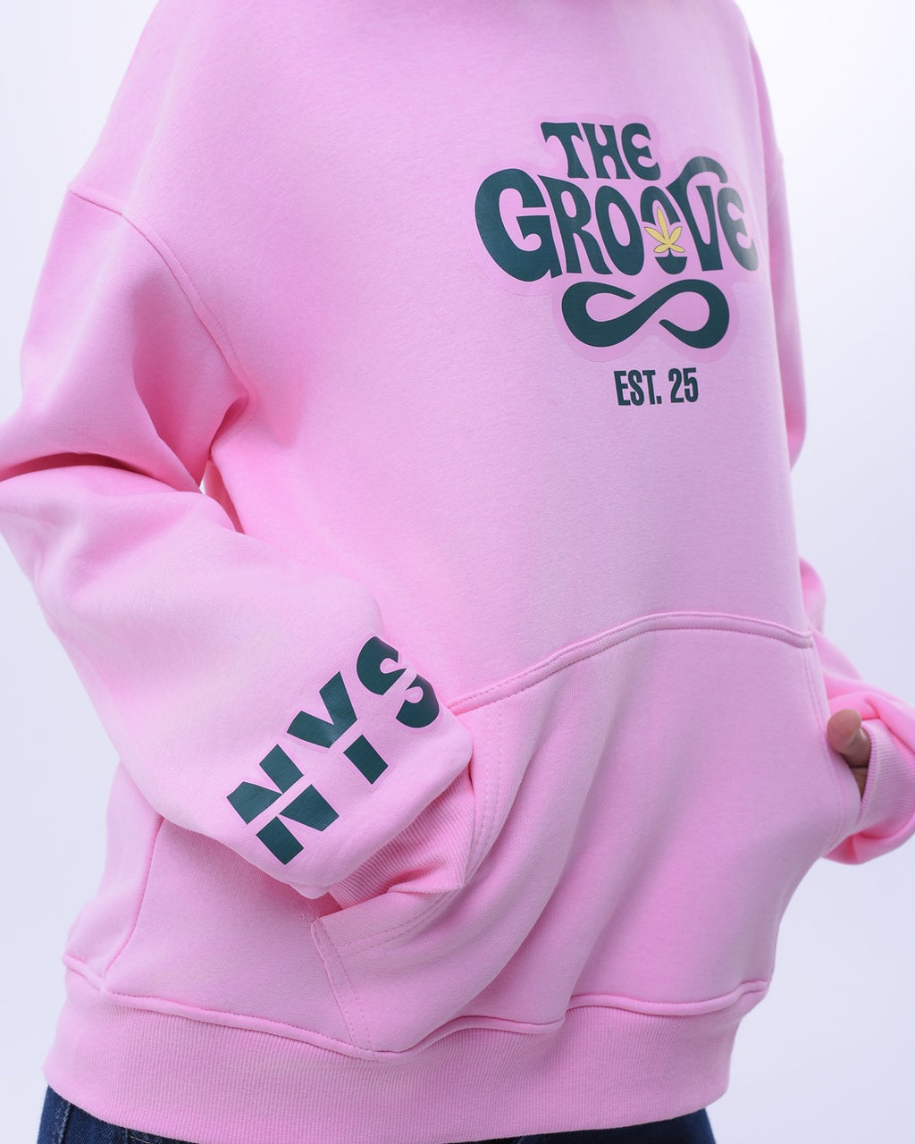 Pink oversized hoodie for women with The Groove graphic and NYS logo on sleeve from NotYourSize2025